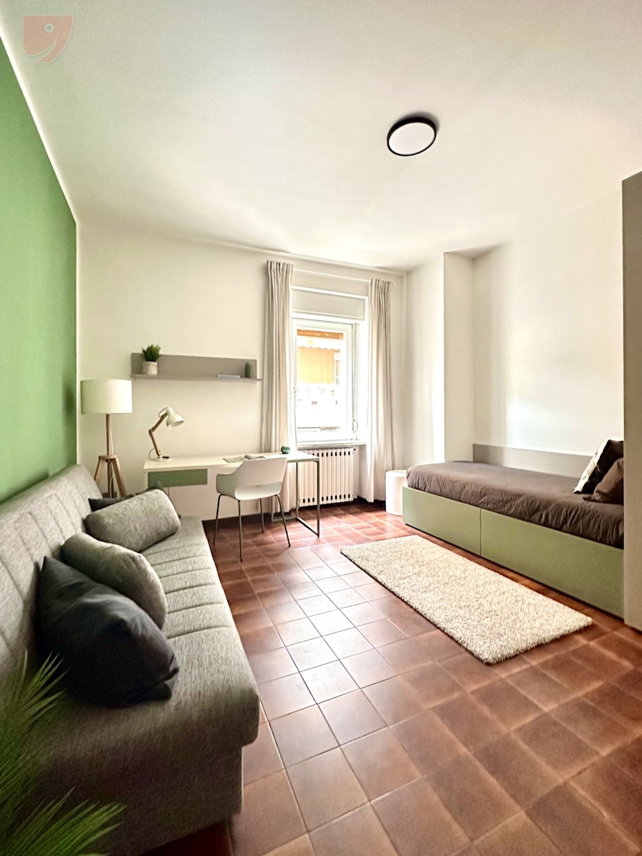 Comfort and Design: Single Room with Sofa Near the Heart of Trento